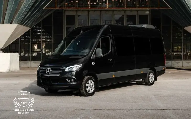 black mercedes benz sprinter limo parked outside building