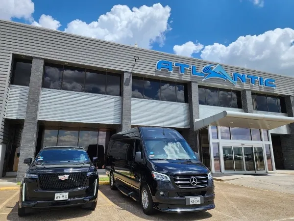 luxury suv and mercedes sprinter at terminal