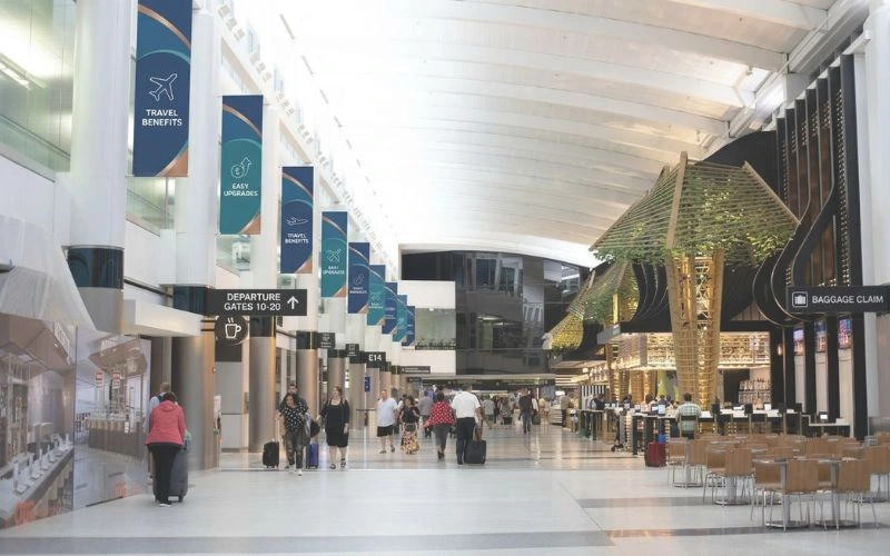 passengers walk through a terminal at houston texas george bush intercontinental airport